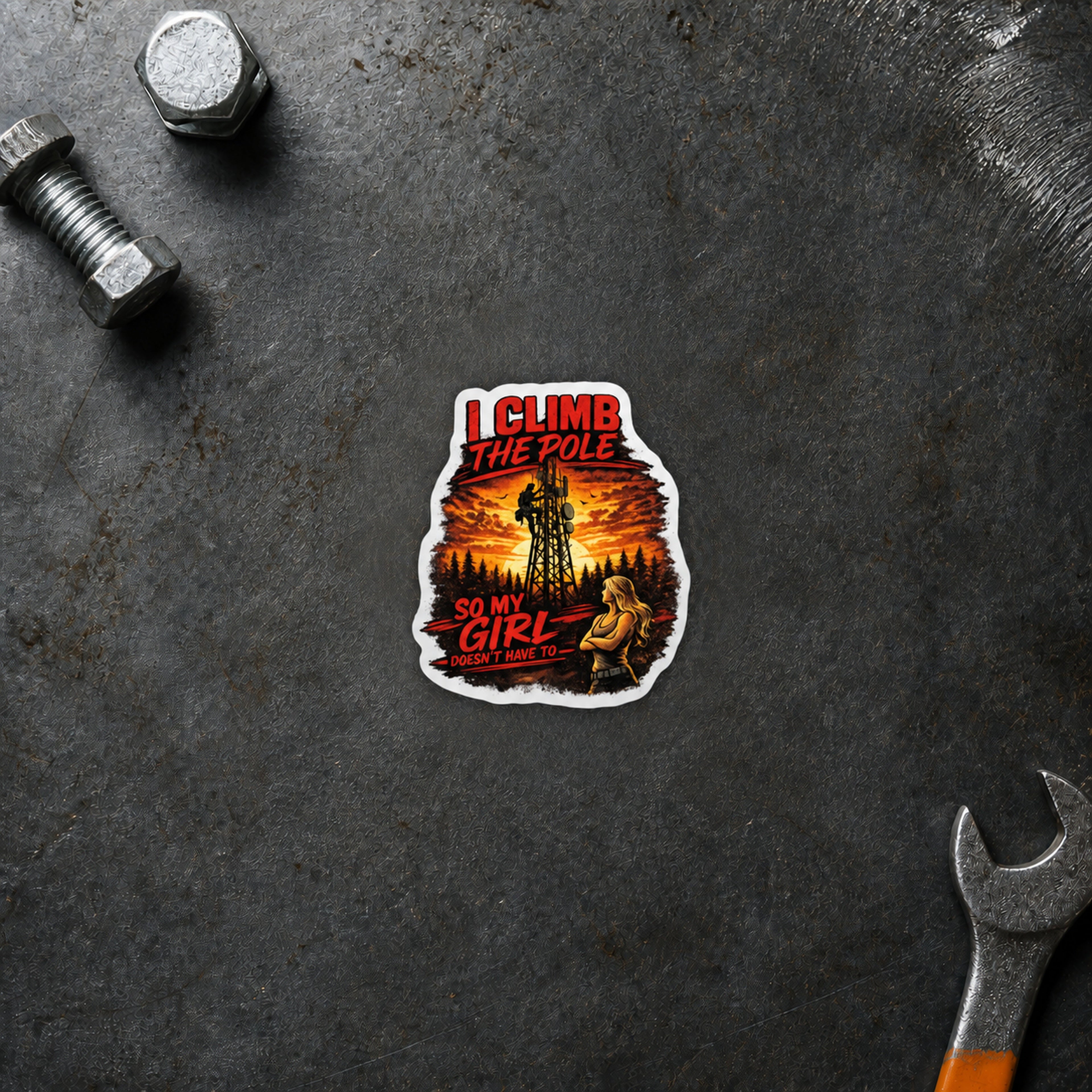 I Climb the Pole sunset sticker displayed on a steel workbench